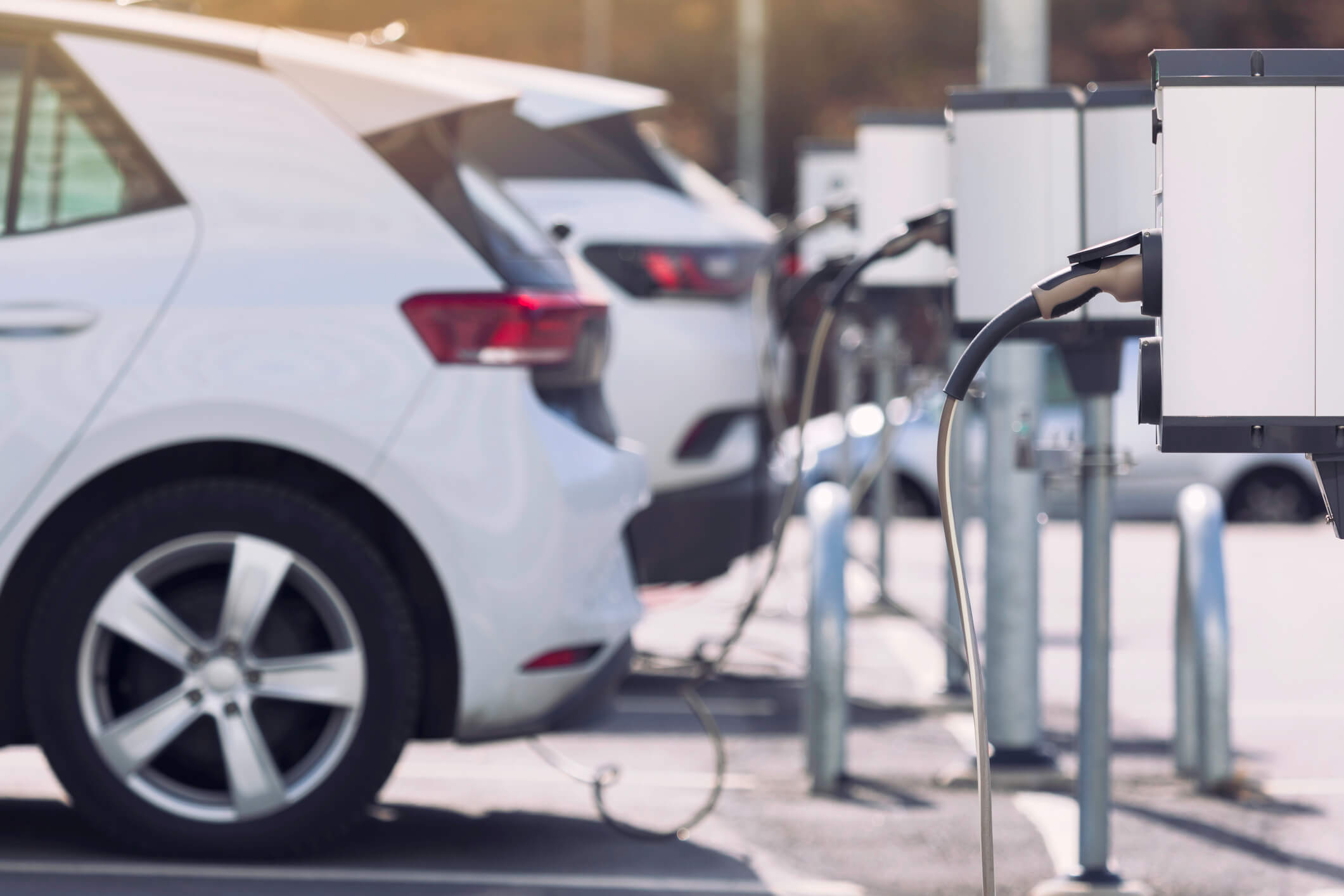 Electric cars charging in a parking lot