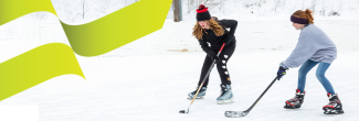 Two girls playing ice hockey