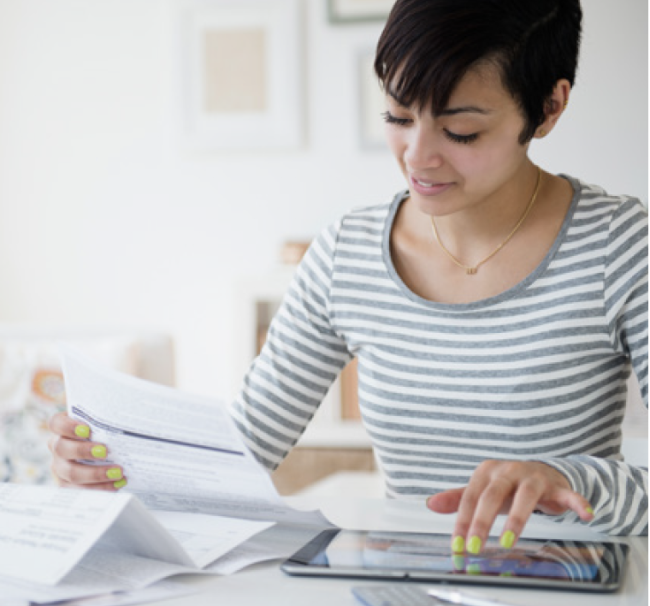 woman looking at a bill 