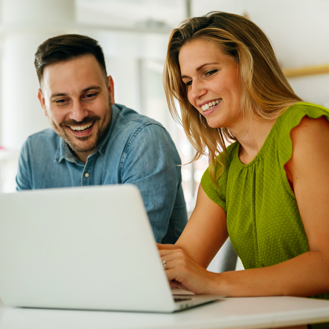 Couple using laptop