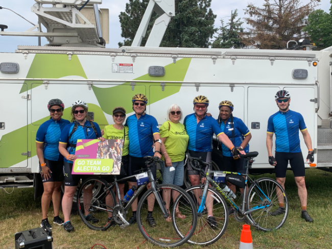 Group photo of Alectra employees with bikes